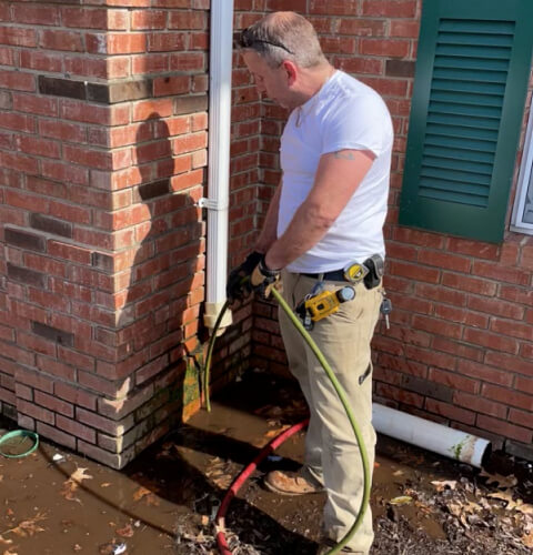 Roto-Rooter plumber service technician Eddie performing a sewer jetting service on a main line in Plainfield, NJ